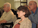 Chris Khan, Sonja Christionat Koehler and Alan Barich listen to Jo Marie Diamond.